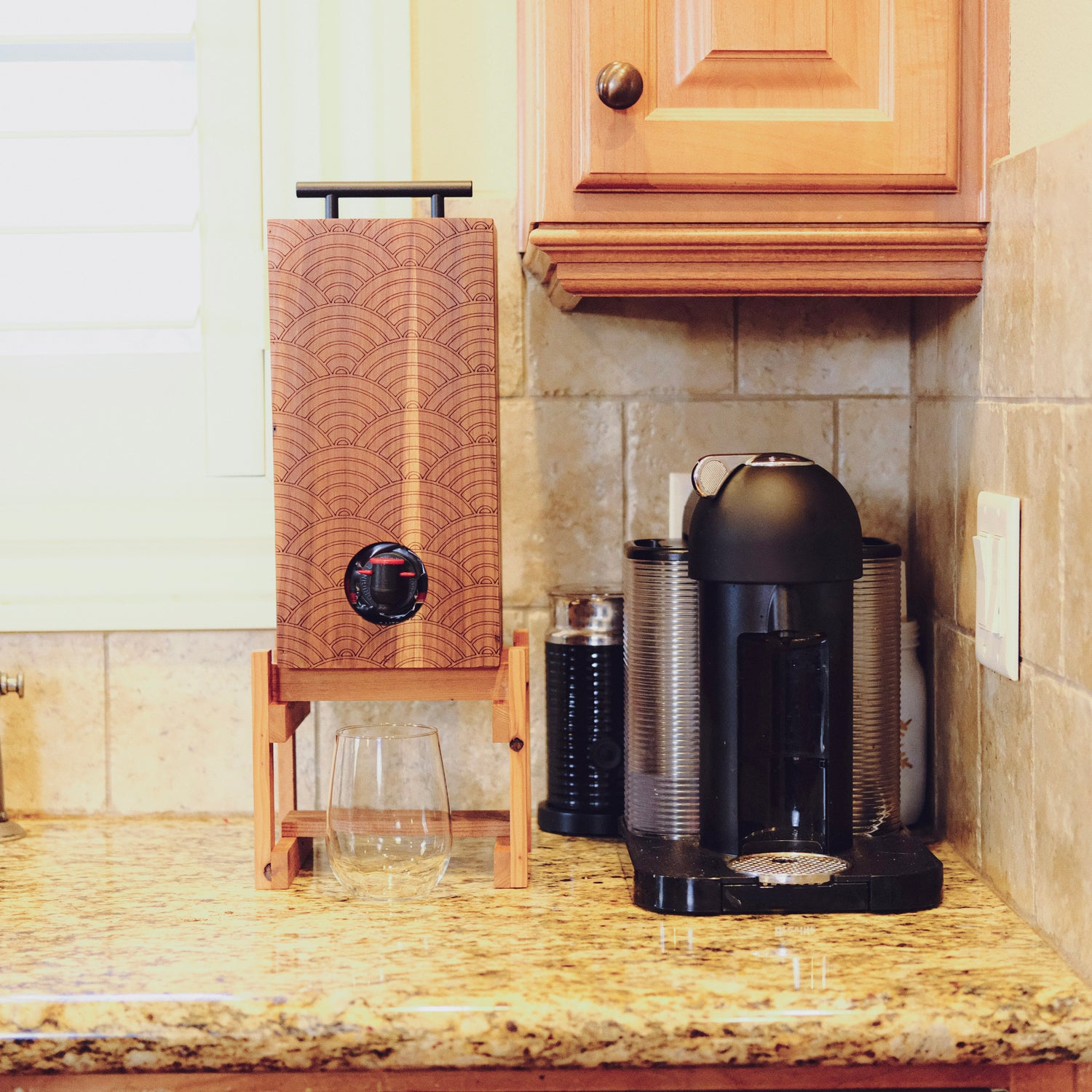 Weekend walls bev box beverage dispenser on kitchen counter with stemless wine glass
